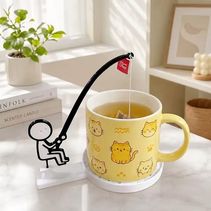 Support de sachet de thé en forme de pêcheur, dessin animé amusant, dessous de tasse bleu ciel pour une pause café unique et durable