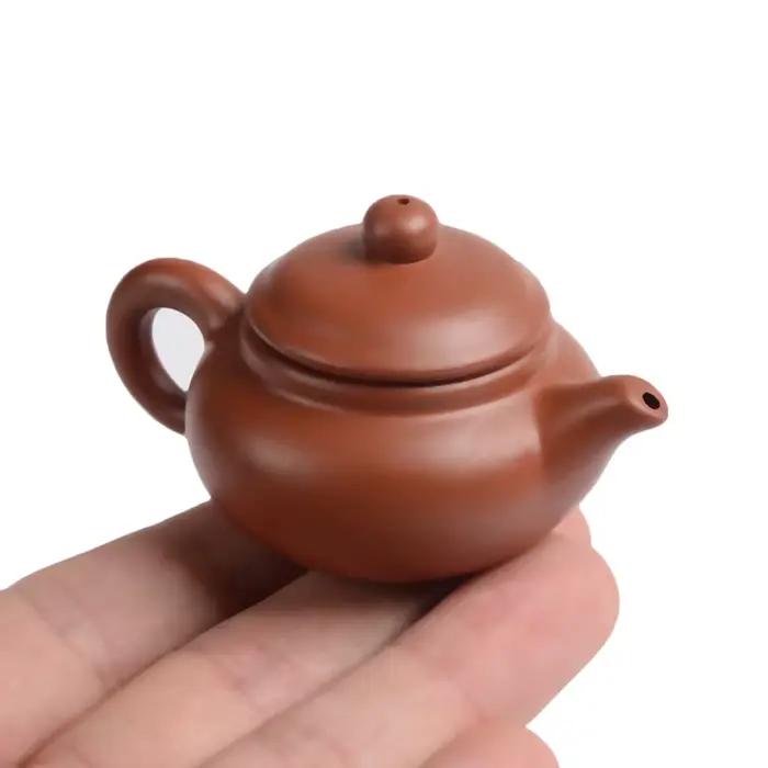 Théière à doigt en argile violette