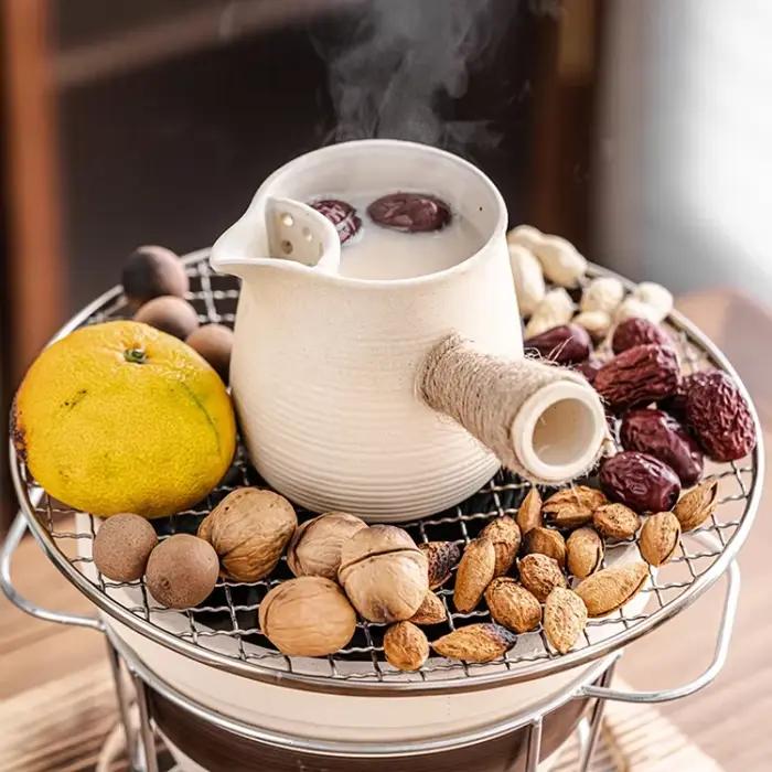 Théière en céramique poterie haute température infuseur lait cuite four sécher herbes couleurs variées cuisine occasions spéciales